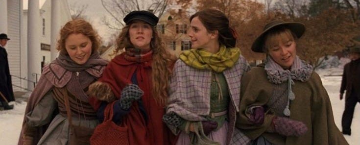 The four March sisters from "Little Women" walking down the street with arms intertwined.